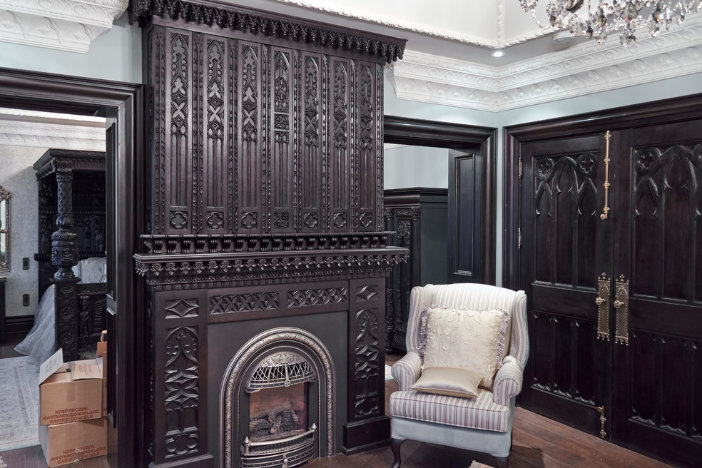 Gothic style victorian living room interior with wooden and brick