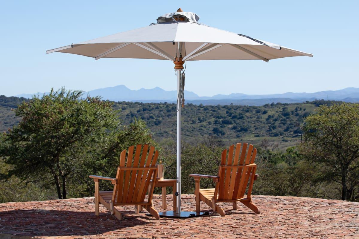 Adirondack Chairs with a Table and Outdoor Umbrella