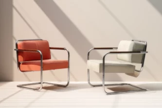 Red and white Bauhaus arm chairs with stainless steel frames, wooden armrests and leather upholstery