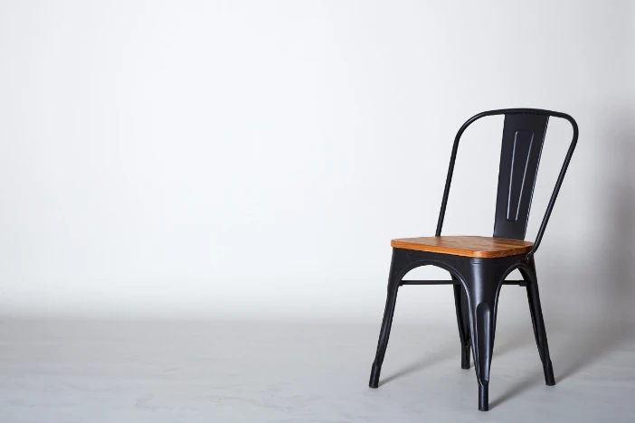 Industrial farmhouse chair with blackened steel frame and wooden seat