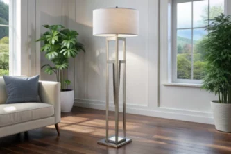 Modern silver metal floor lamp with white drum shade in living room with hardwood floor, sofa and potted plants