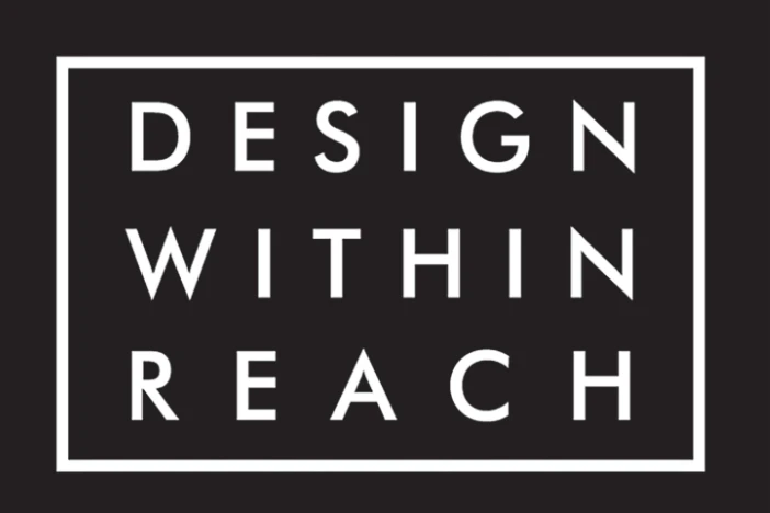 White uppercase sans serif font Design Within Reach logo in a matching rectangular box on black background