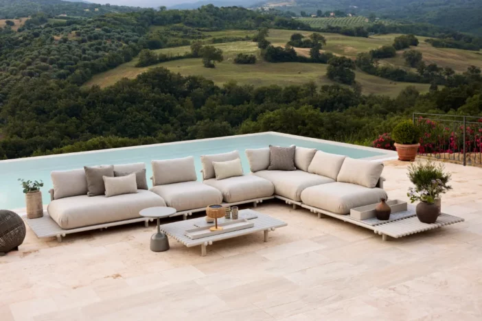 Modern low-profile patio sectional with plump beige cushions