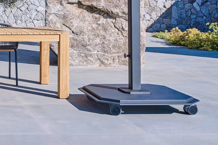 Solid stacked steel plate umbrella base with charcoal finish and wheels