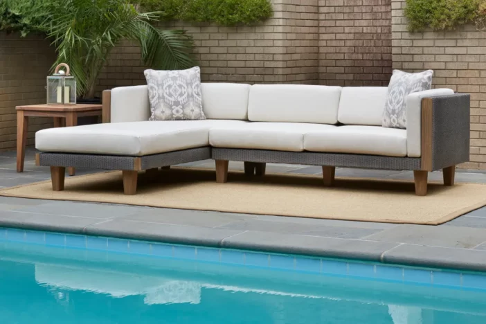 Wooden patio sectional sofa with grey rope sides and white cushions