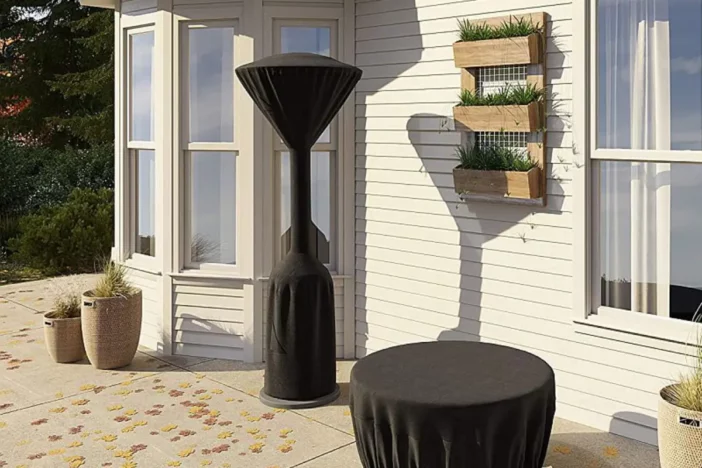 Mushroom style patio heater and table with matching protective black covers