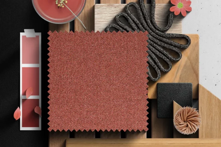Fabric and material swatches with a muted red and dark brown palette