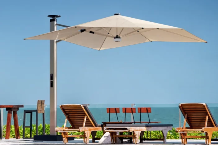 Modern cantilever umbrella with a control panel on the mast, LED light and wind sensor