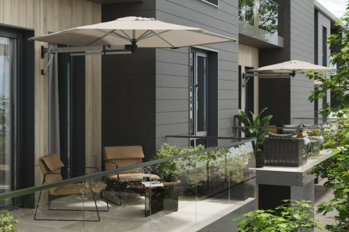 Small wall-mounted umbrellas with off-white octagon canopies shade lounge seating on glass-walled balconies