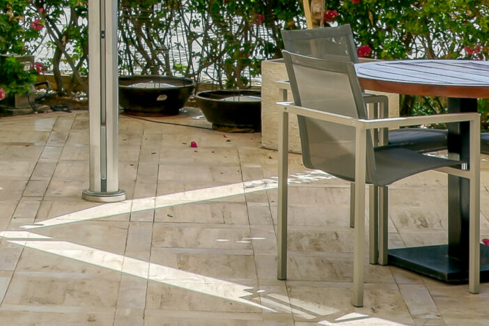 Permanent patio umbrella surface mount on a tiled terrace